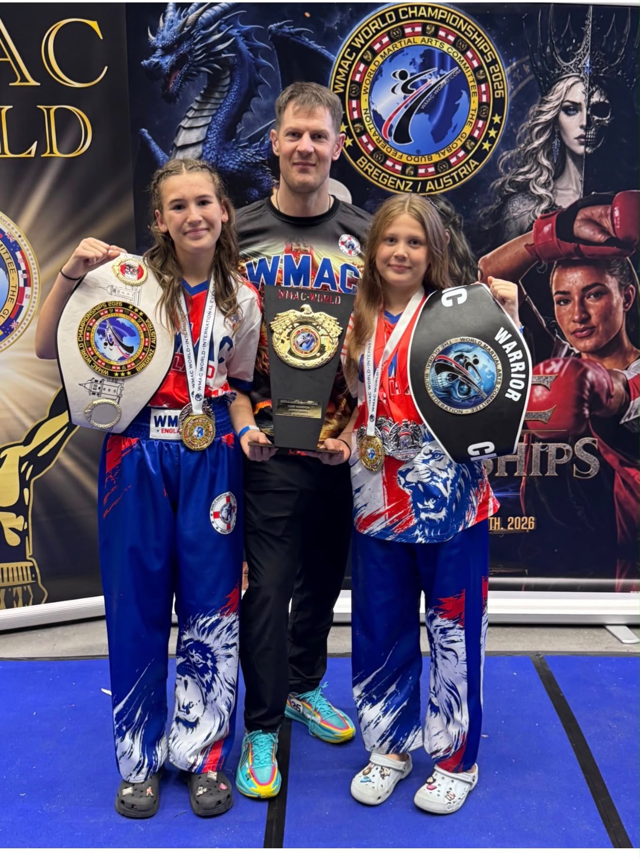 Team Nemesis fighters with their belts at the WMAC World Championships, Bregenz, Austria, 2026